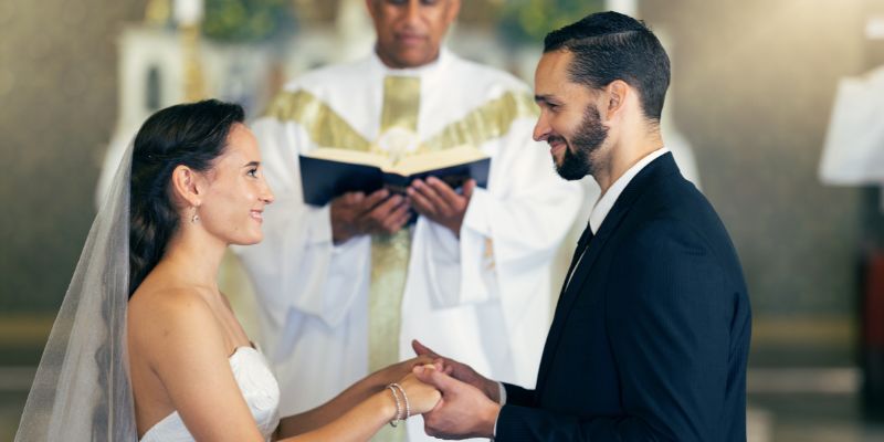 A bride and groom at a Catholic wedding exchanging vows, symbolizing the idea that love and commitment must be freely given